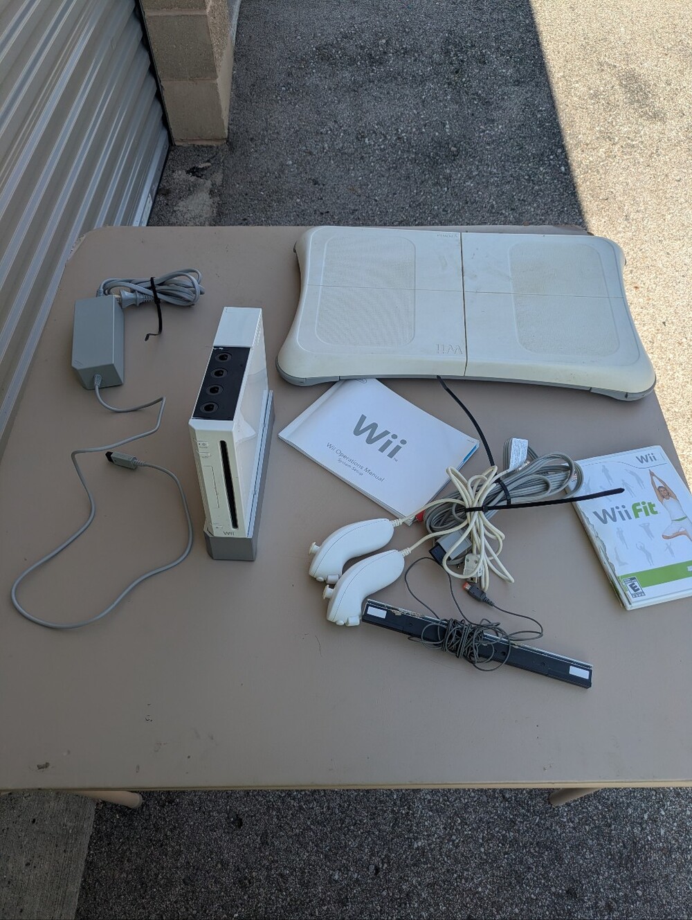 Nintendo wii with wii fit game and board no controllers